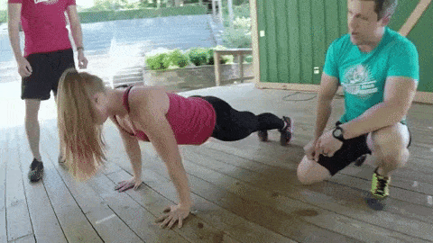 This gif shows coach doing a push-up in perfect form.